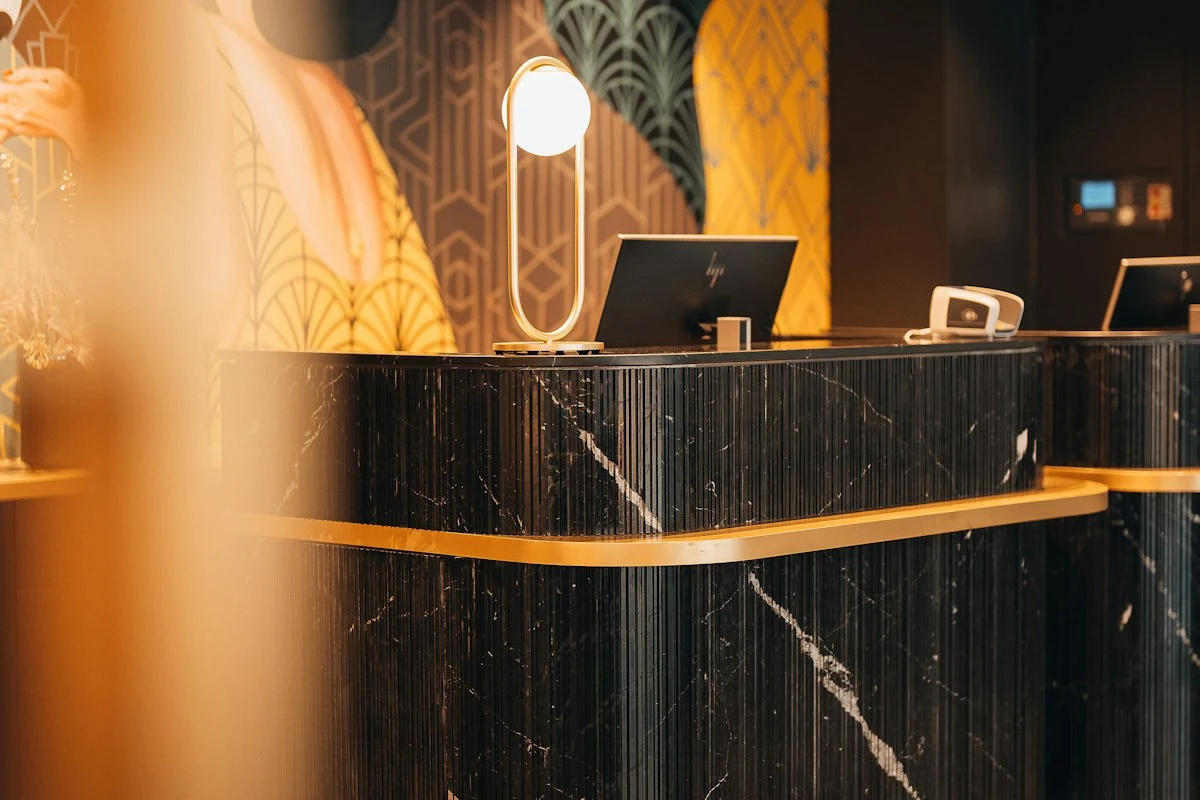 Modern corporate reception desk representing 24/7 AI receptionist booking
