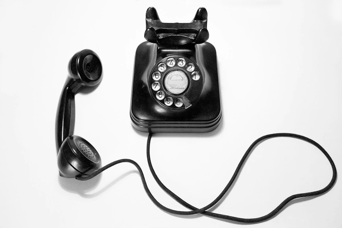 Modern telephone handset on desk representing conversational AI telephony