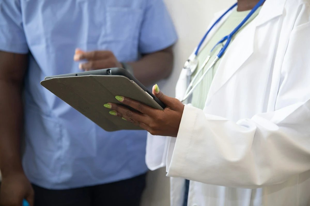 Healthcare clinician holding digital tablet in modern medical facility